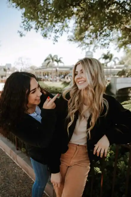 Two friends smiling about their PTSD treatment