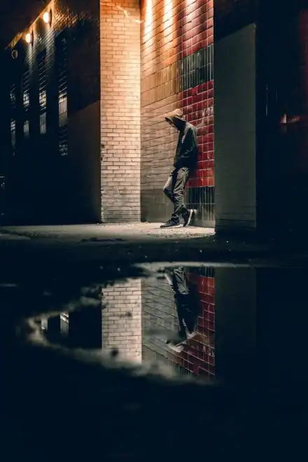Guy in an alley dealing with his depression